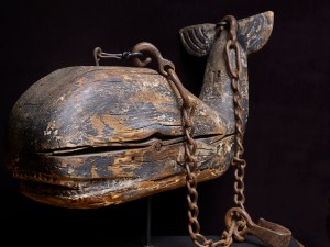 Wooden whale-trade sign which hung above a merchant’s doorway in New Bedford