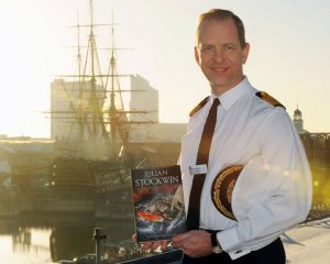 Captain Kyd, former CO of HMS Ark Royal with Victory in front of Victory