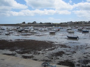 Barfleur has a huge tide range; the harbour at low water